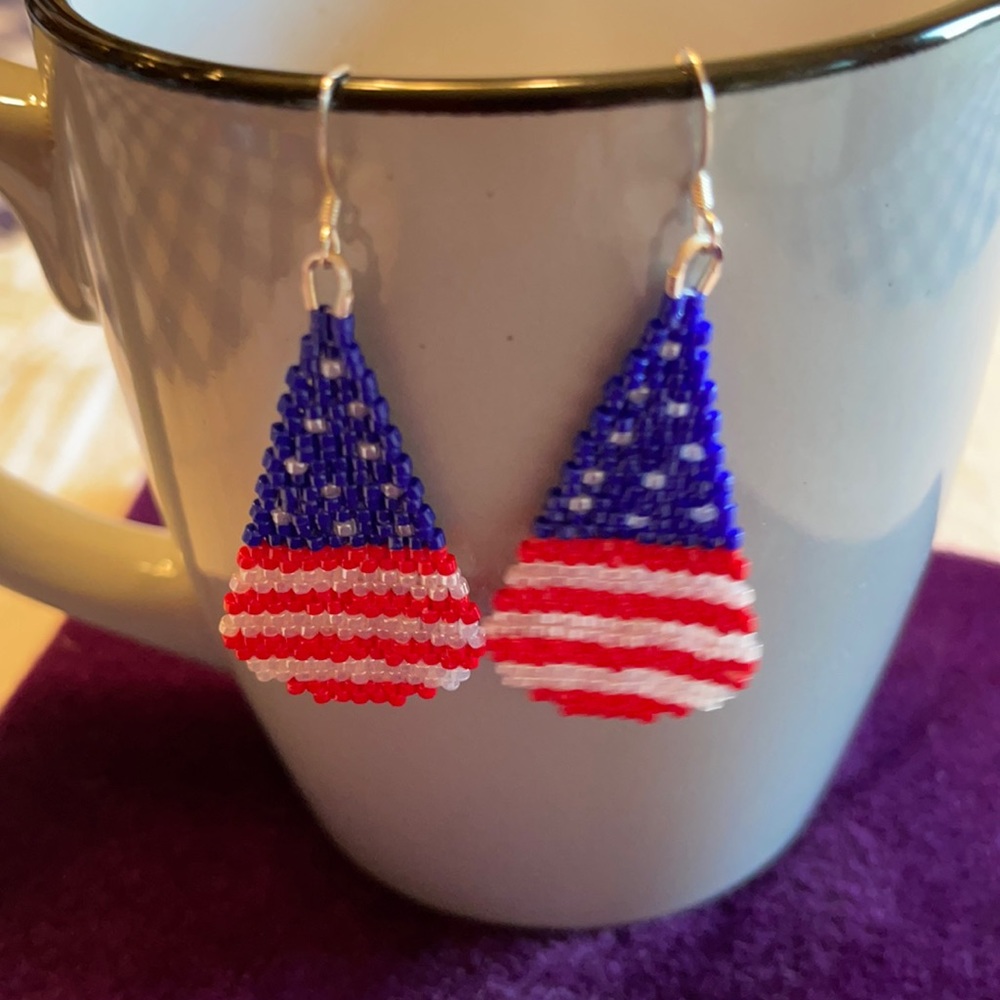Hand beaded tear drop earrings.